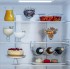 Racks de Bebidas em Aço Cromado: armazenam com elegância 3 grandes garrafas como as de vinho em cada compartimento refrigerado liberando mais espaço nas prateleiras das portas para as bebidas de consumo mais frequente.
